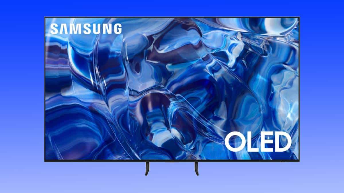 A Samsung S89C oled tv displaying an abstract blue liquid swirl pattern on its screen, placed against a plain blue background.