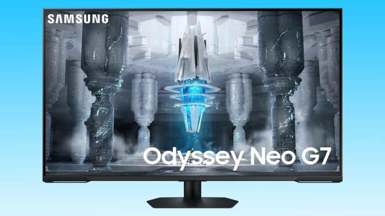 Samsung Odyssey Neo G7 4K gaming monitor displaying a vibrant sci-fi scene with illuminated blue structures and dark towering columns.