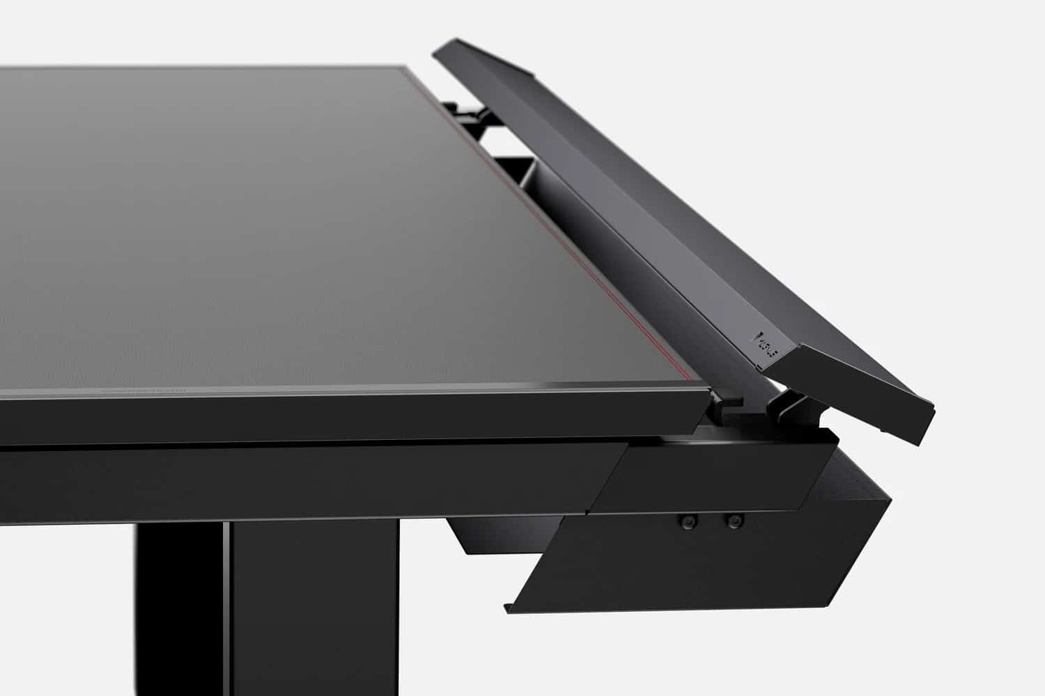 Close-up of a modern, minimalist black Secretlab Magnus Pro gaming desk with adjustable sections and a sleek design, viewed from the side.