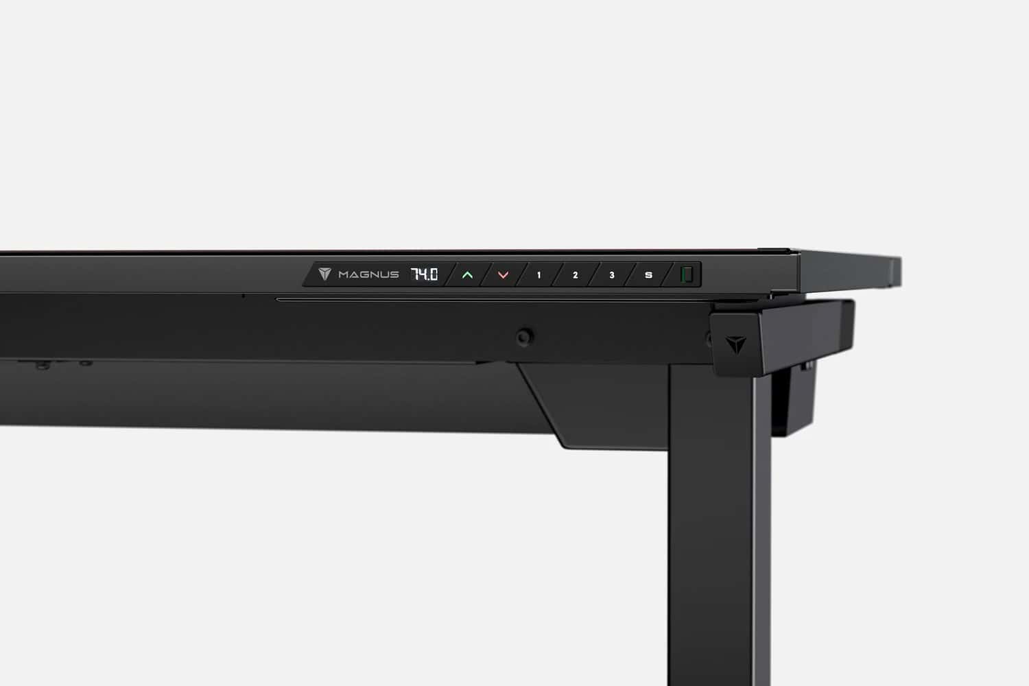 Close-up view of a black adjustable height desk with control buttons and a brand logo on the front panel.