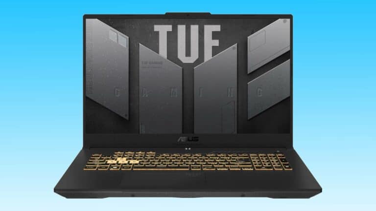 A black ASUS TUF Gaming F17 laptop displayed against a blue background, featuring a prominent logo on the cover and a golden-backlit keyboard.