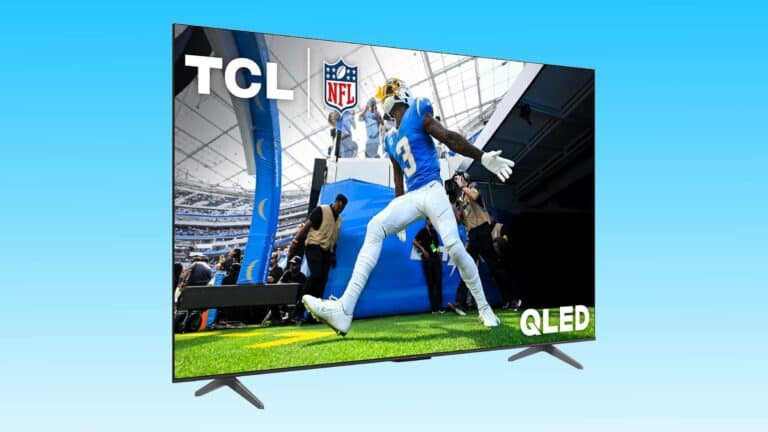 A TCL 75-inch Q6 QLED Smart TV displaying an NFL player mid-jump during a game, enhancing the live sports viewing experience.