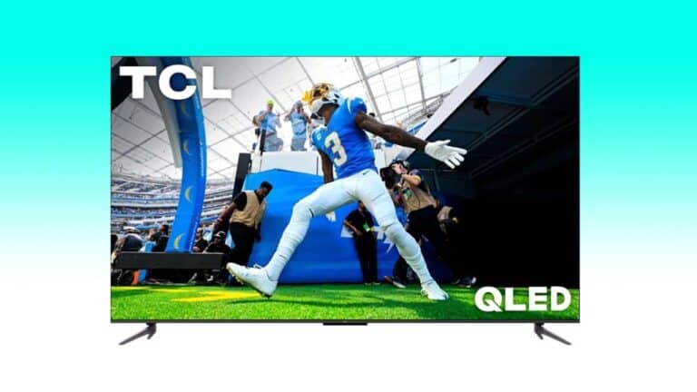 A football player in blue uniform jumps to catch a ball on a 4K TV deal screen, with audience and stadium backdrop.
