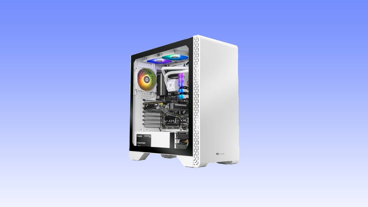 White modern gaming pc deal with transparent side panel showing internal components and multicolored LED lights, set against a simple blue background.