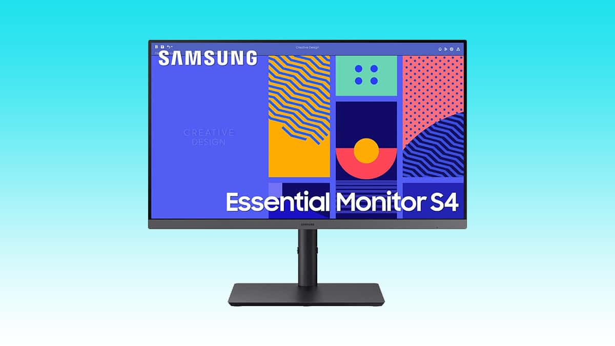 A samsung essential monitor s4 displaying colorful abstract graphics on a blue background.