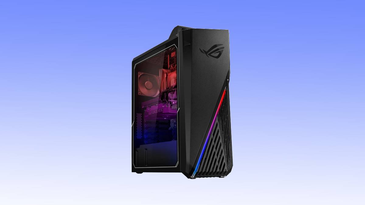A black gaming desktop tower with angular design and RGB lighting, featuring side window panel revealing internal components. It has a printed ROG logo on the front. The background is gradient from blue to white.