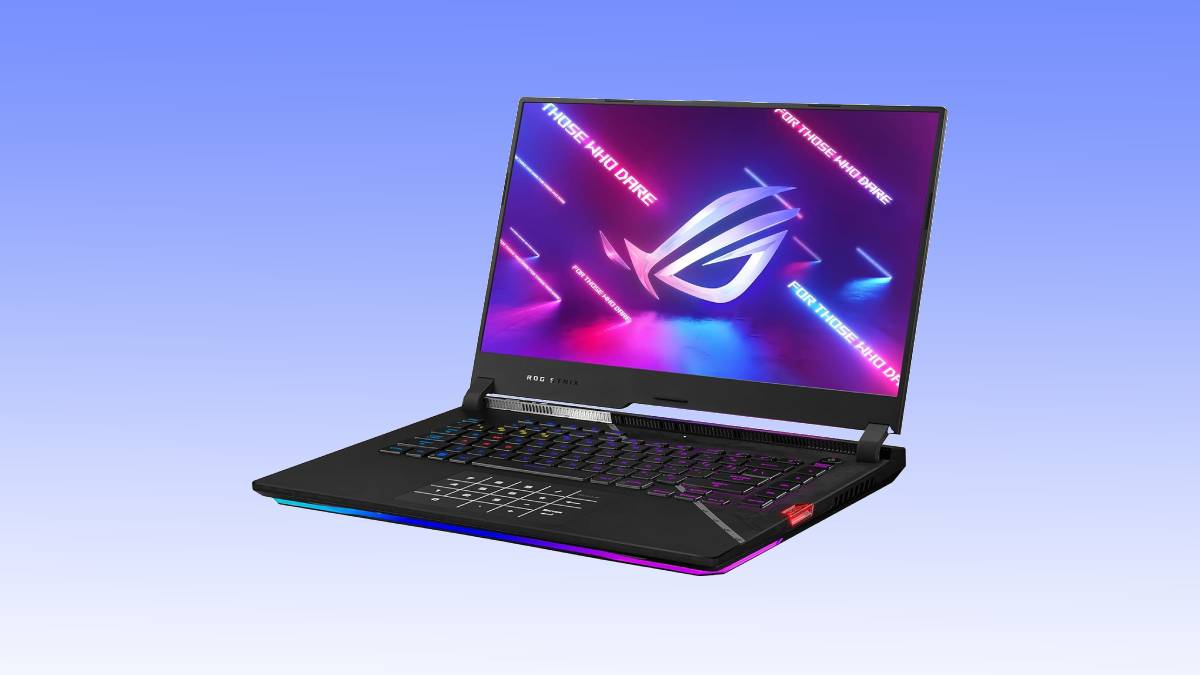 An open gaming laptop displaying a colorful asus rog logo on its screen, set against a gradient blue background.