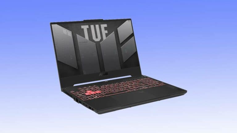 A black Asus TUF gaming laptop deal open and facing forward, displaying a patterned lid design, with a red-backlit keyboard, set against a light blue background.