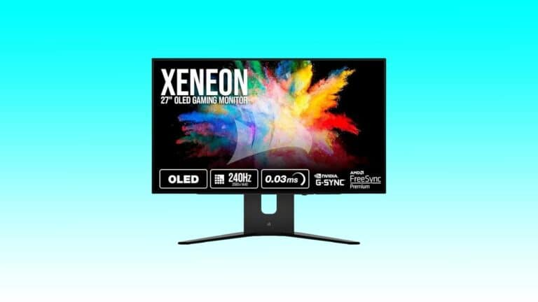 A 27-inch Corsair gaming monitor displaying a vibrant color explosion graphic on its screen, featuring 240hz refresh rate and g-sync compatibility details.