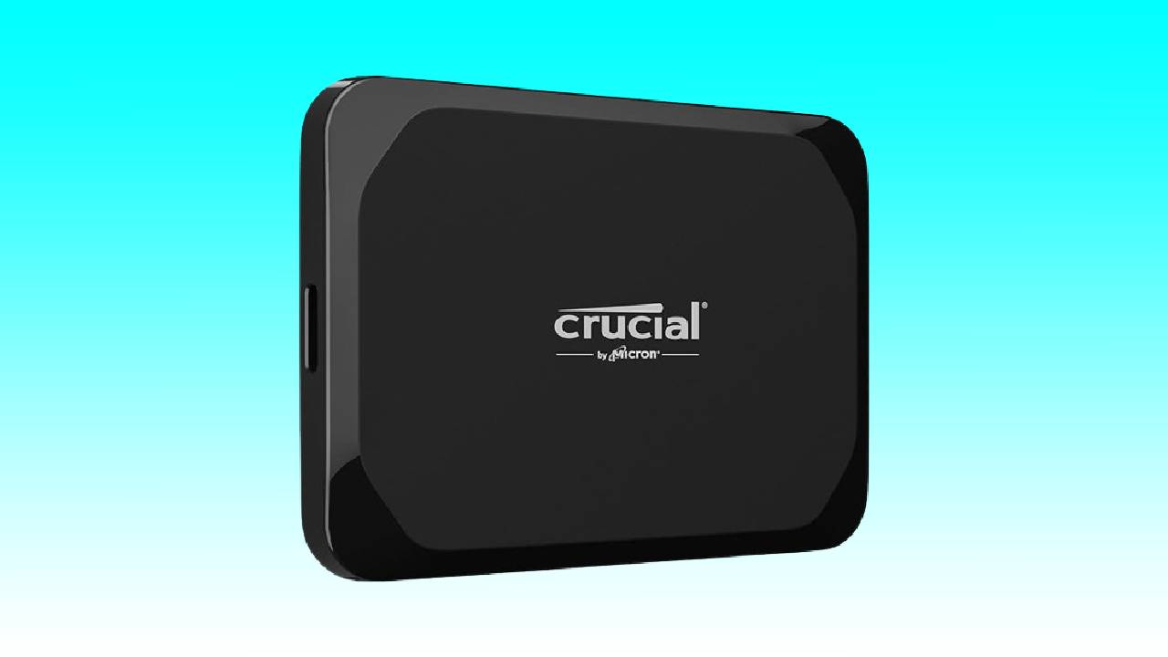 Black crucial brand 2TB SSD external solid state drive on a blue gradient background.