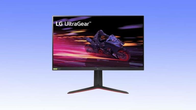 The LG UltraGear gaming monitor, available in a fantastic gaming monitor deal, showcases an image of a motorcyclist in motion with streaks of light illuminating the background. It features a slim bezel and a sleek V-shaped stand.