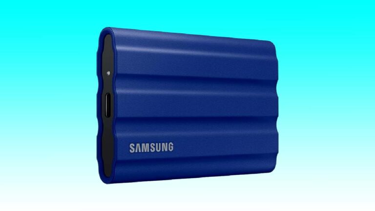 Blue Samsung 1TB portable SSD on a blue background, featuring a ridged design with a visible USB port on the side.