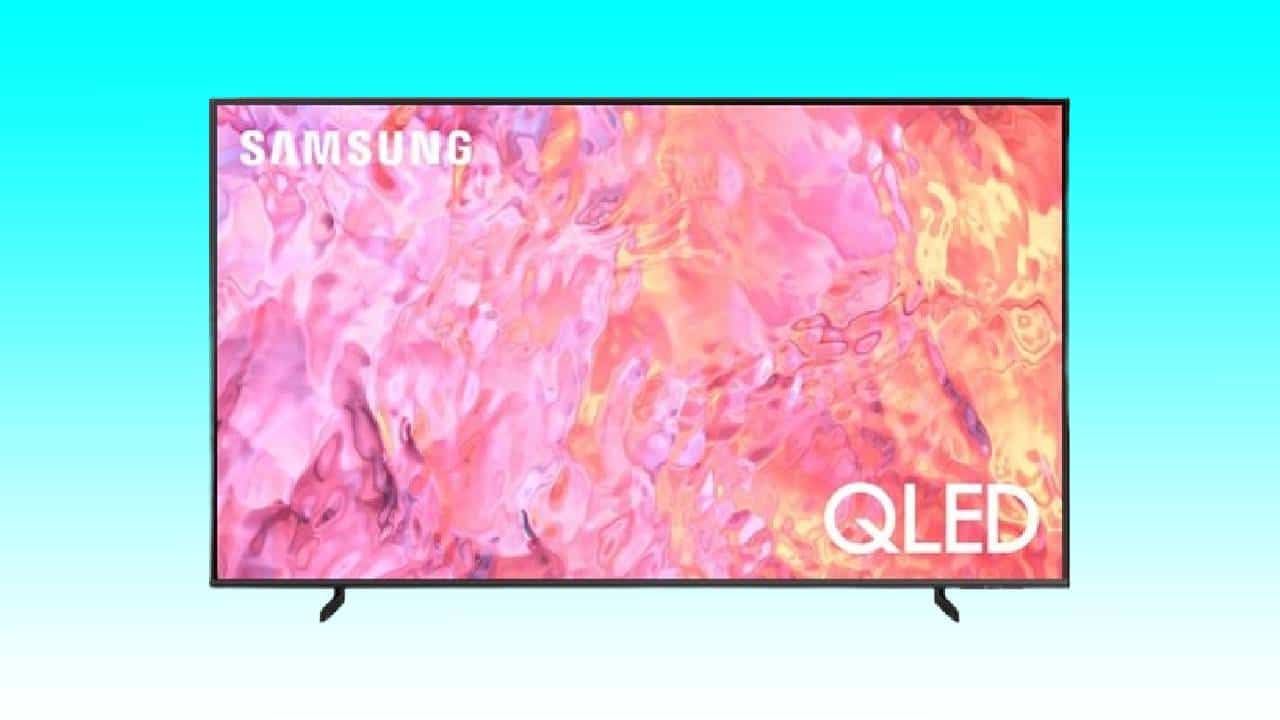 A Samsung Q60C QLED TV displaying a vibrant, abstract pink and orange image on its screen, set against a light blue background.
