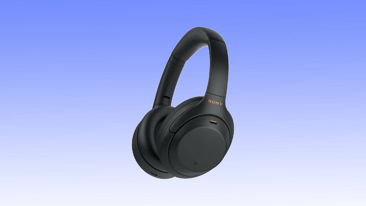 A pair of black Sony over-ear wireless headphones with a curved headband and cushioned ear pads, showcased against a gradient blue background—don't miss out on this fantastic headphones deal!