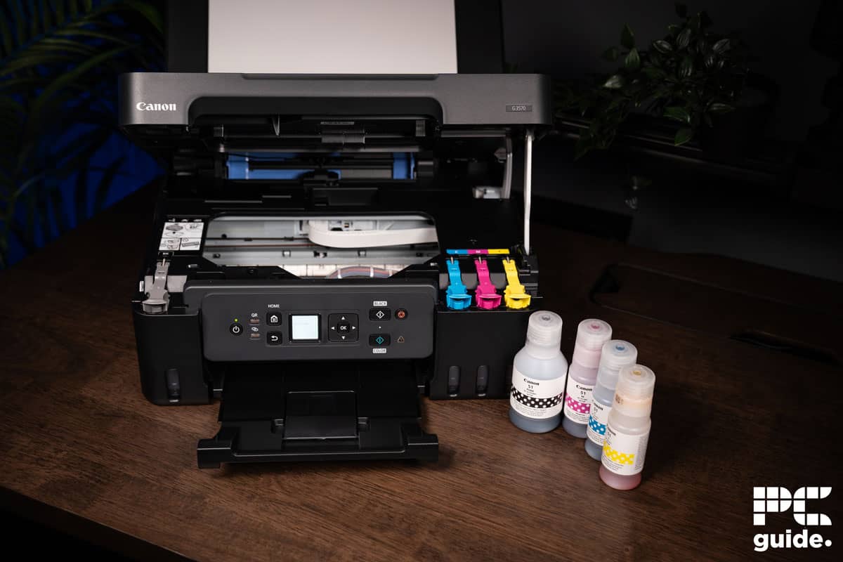 Canon PIXMA G3570 open printer and ink bottles, Image by PC Guide