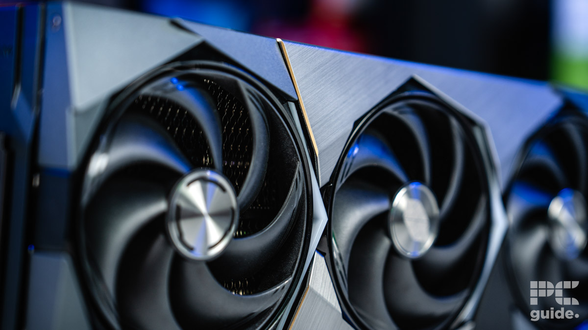 A close up of the silver MSI Suprim SOC RTX 5090 front plate. A close up of two of the fans and heatsink behind.