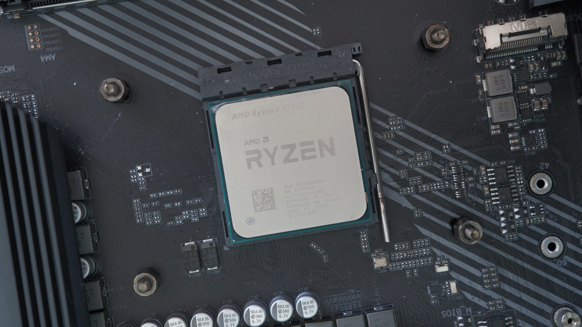 AMD Ryzen 7 5700X seated in Socket AM4 motherboard, image by PC Guide