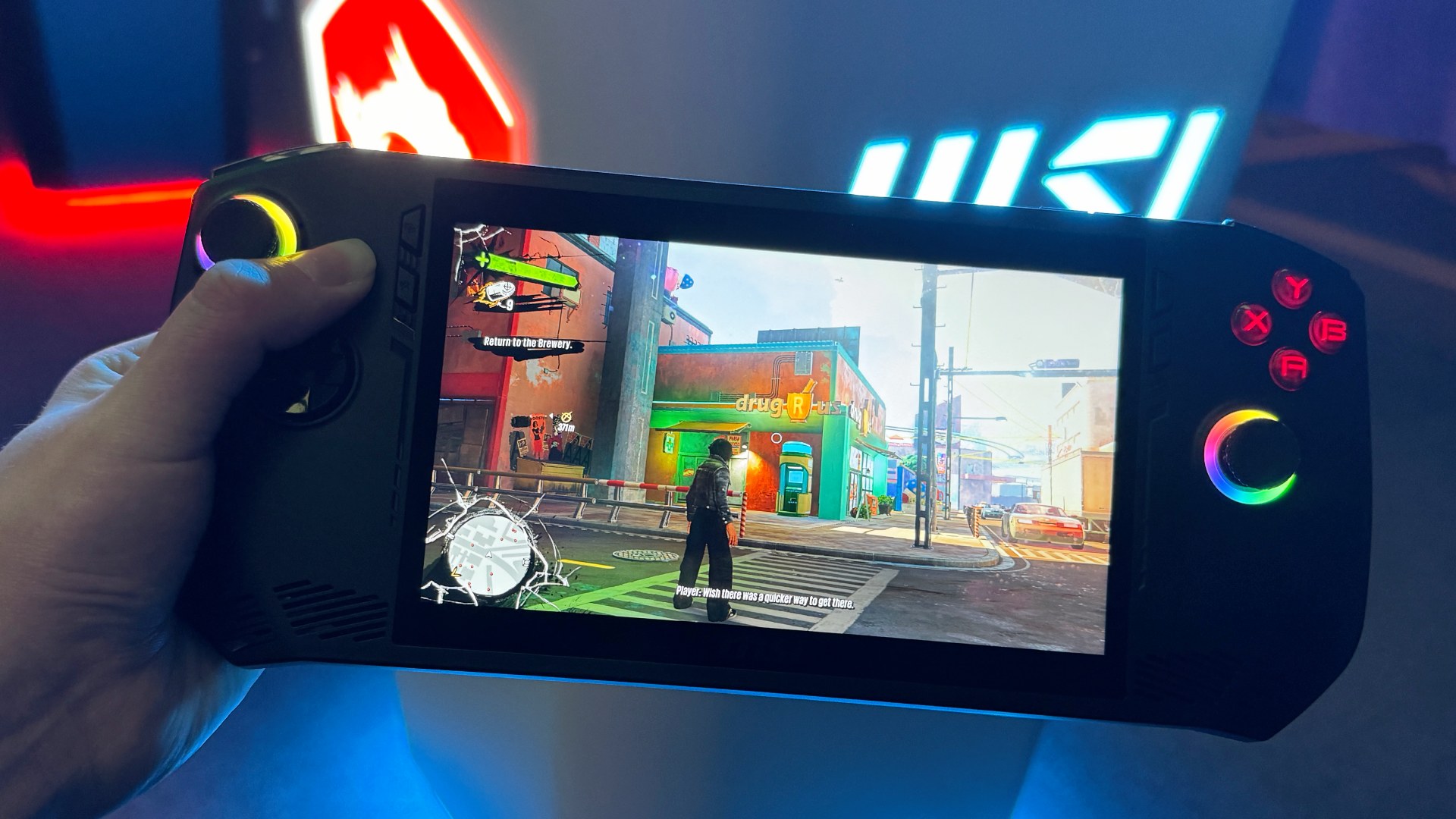 MSI Claw handheld being held in one hand, image by PC Guide