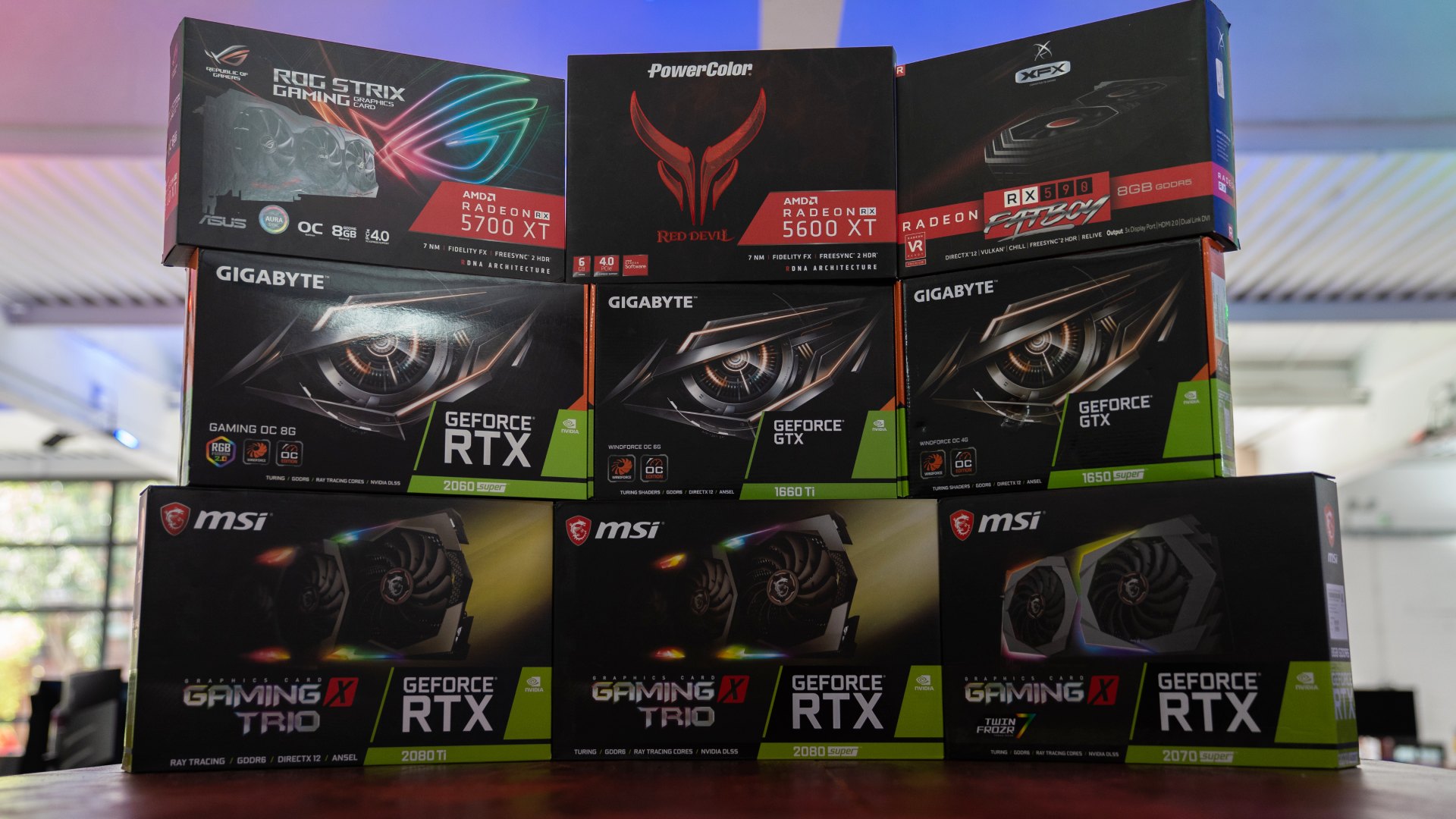 GPU product boxes stacked on table, image by PC Guide