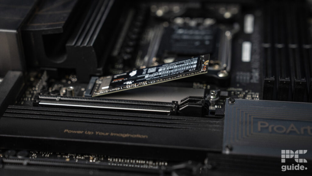 The WD_Black SN8100 NVMe SSD placed into a ProArt motherboard stoarge slot still angled up and not screwed in