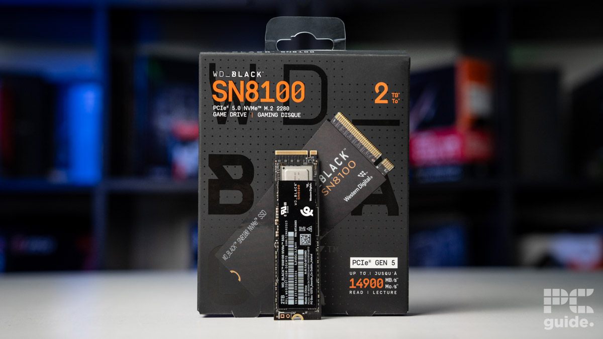 The WD_Black SN8100 NVMe SSD standing up leaned against its box
