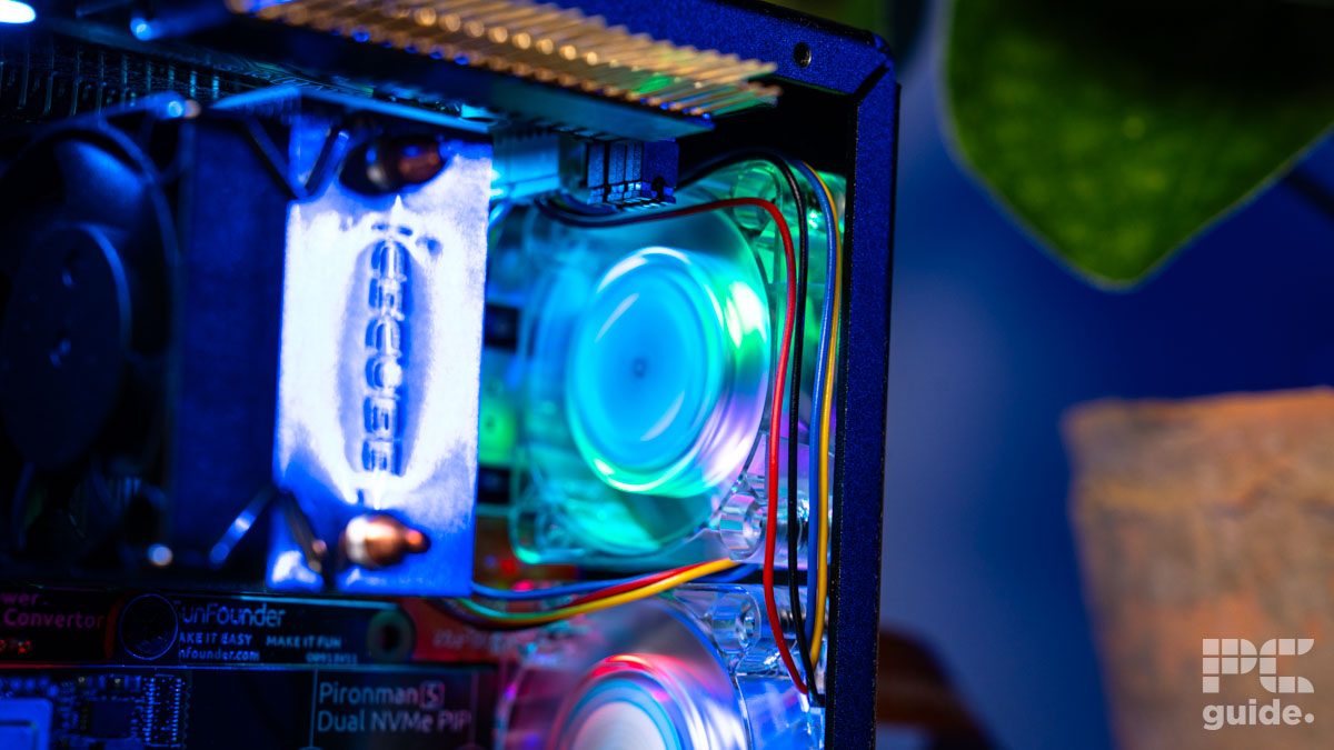 The Pironman 5 max case with a focus on the back fan with RGB lighting as cables go around it.