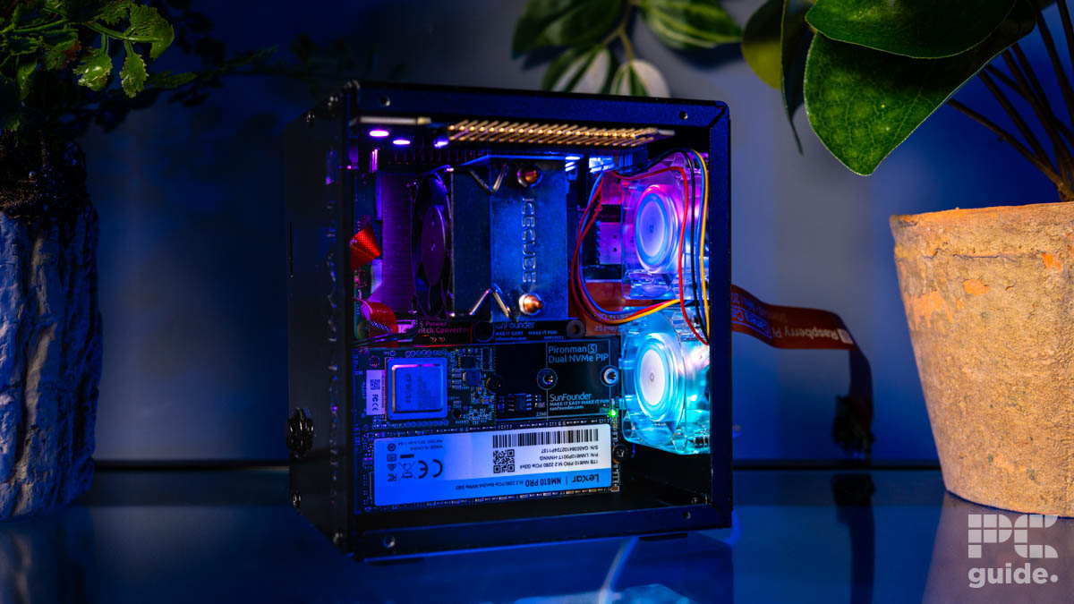 Pironman 5 Max, case built in from the side built in. It shows components and fans lit up and the CPU cooler.