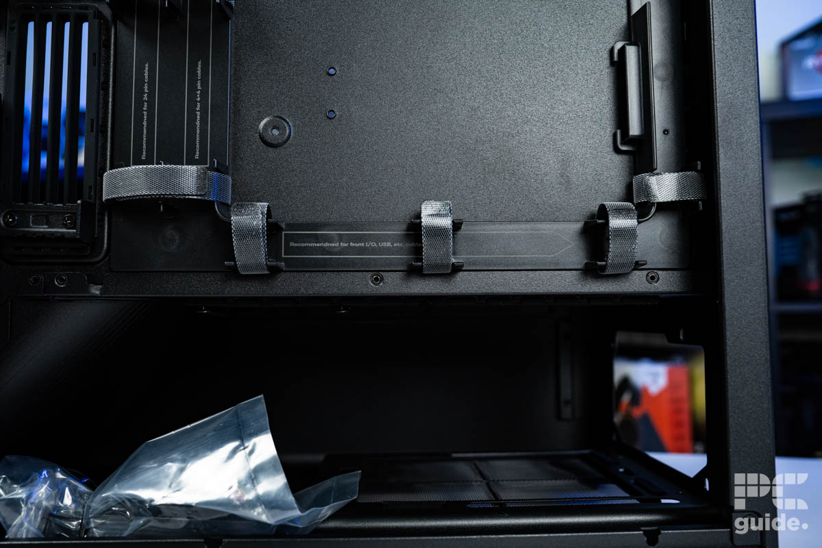 The bottom of the left side of the HAVN BF 360 Flow. It shows the PSU compartment and above it the channels and velcro straps to hold cables in.