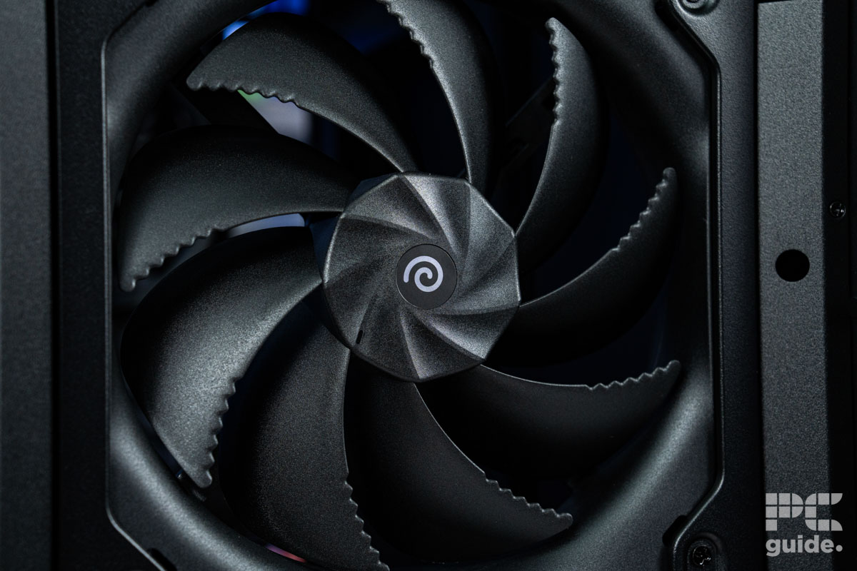 A black 180mm fan at the fron of the HAVN BF 360 Flow case, it has a spiral logo in the midal with a ridged hub towards the fins theat curve out and with slits at the edge.