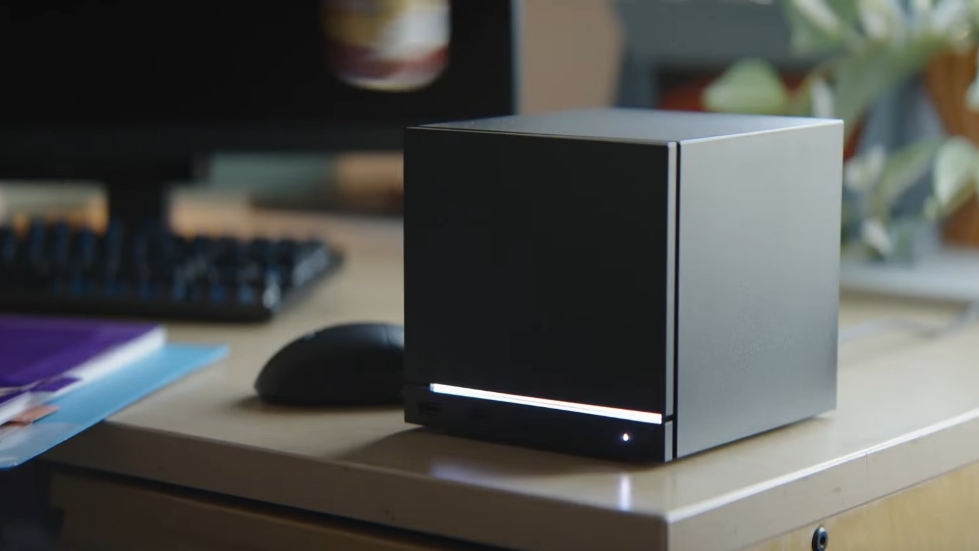 Steam Machine on desk with a mouse, keyboard, and monitor